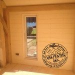 Oak Timber Framed Glazing with Painted Cladding on New Build Oak Framed Summerhouse in Devon by Carpenter Oak Ltd