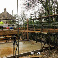 concrete and scaffolding for a new oak frame