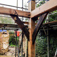 Post and crossbeams of a self build oak frame during construction