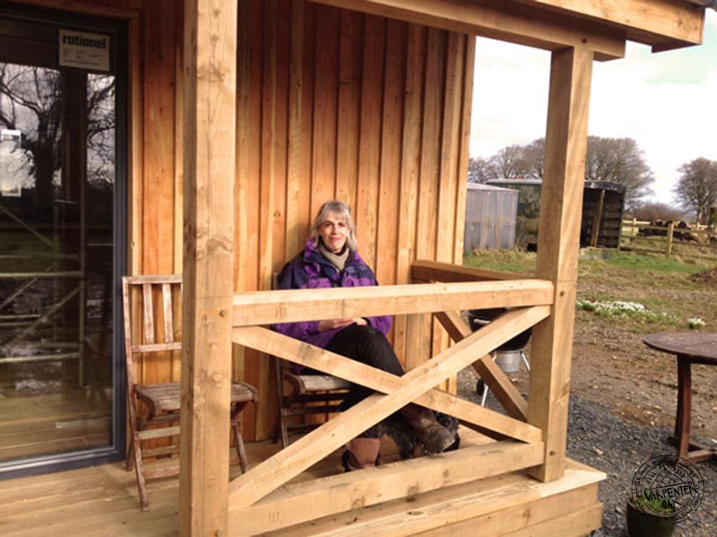 Vickie Ward Outside her Carpenter Oak Timber Framed Eco Cabin