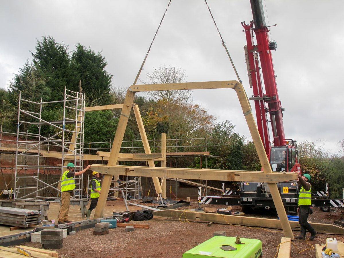 Frame raising with a crane - Carpenter Oak Orchard House