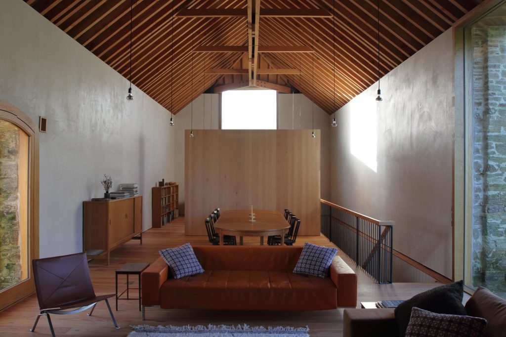 award winning timber frame homes. Redhill barn oak studio living area.